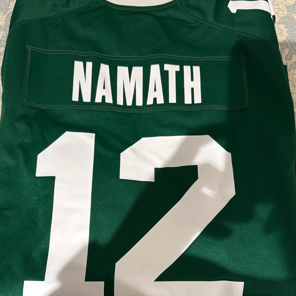 NY Jets NFL Jersey with Number 12 Joe Namath. Oroginal brand new with tags!